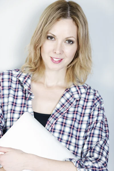 Woman holding laptop computer — Stock Photo, Image