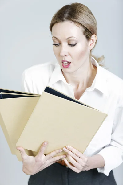 Business woman juggling folders — Stock Photo, Image