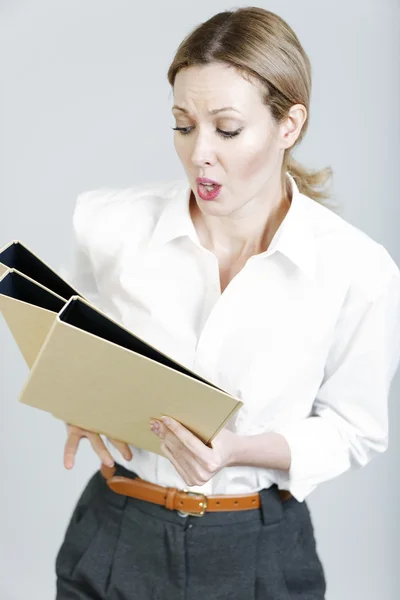 Business woman juggling folders — Stock Photo, Image