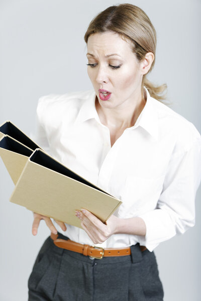 Business woman juggling folders