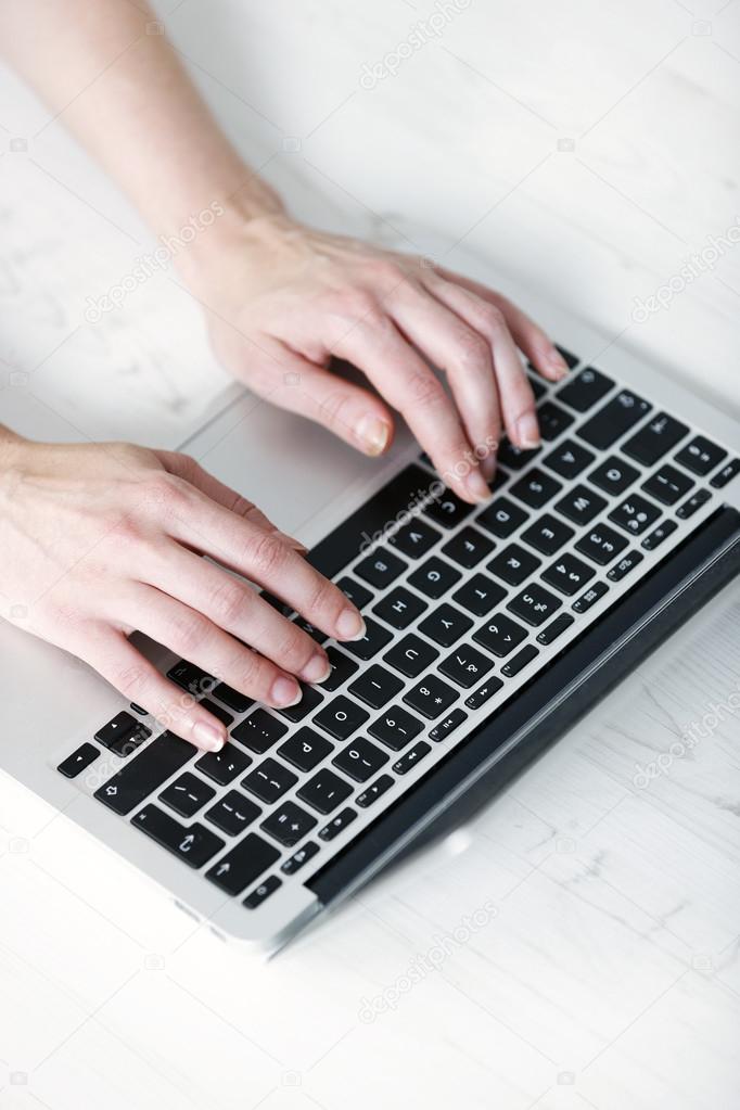 Woman using modern laptop