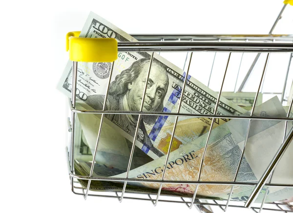 Closeup money in shopping cart on side view — Stock Photo, Image