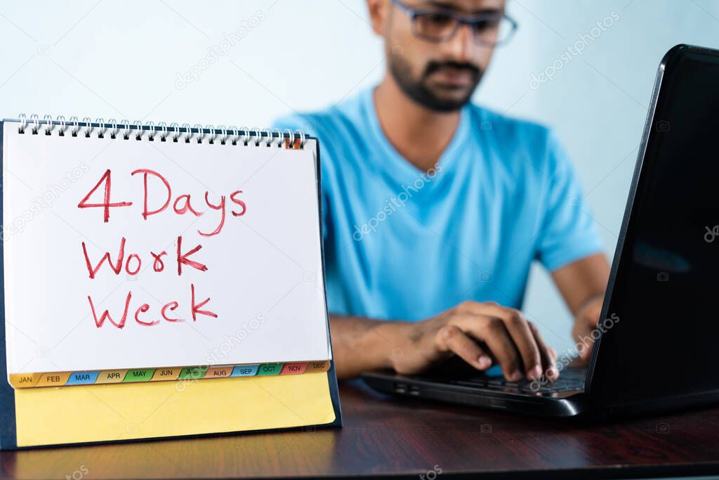 focus on calender, Concept of four or 4 days work week showing by young man working in background and shows calendar