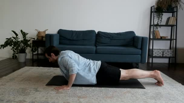 Young Man Doing Yoga Doing Push Ups Floor House Cozy — Stock Video