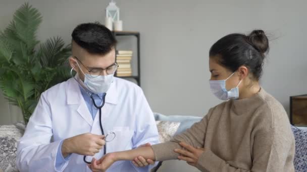 Positive Male Physiotherapist Doctor Checks Smiling Young Female Patient Lung — Stock Video