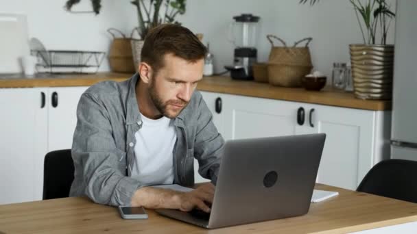 Young Freelance Man Works Computer Looks Monitor Screen Room Home — Stock Video