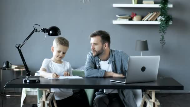 Young Man Father Doing Homework His Son Studying Sitting Table — Video Stock