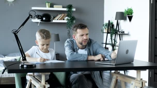 Father Son Doing Homework Together Home Studying Sitting Table Bright — Wideo stockowe