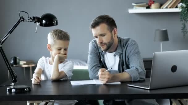 Man Helping Young Boy Room Doing Homework Smiling Studying Sitting — Stok Video