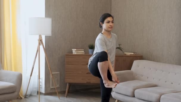 Close Woman Does Exercise Balance Stands One Leg Yoga Pose — Stock Video