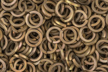 Brass color steel grover washers for industrial manufacturing. Texture background of grover washers. Hight resolution macro photo. No depth of field. clipart