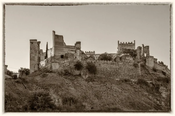 exterior wall of the castle of Escalona, in the province of Toledo. Spain. turned to selenium like an antique postcard