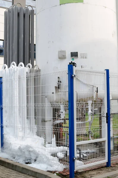 Outside liquid nitrogen tank. liquid nitrogen flows out and turn into ice