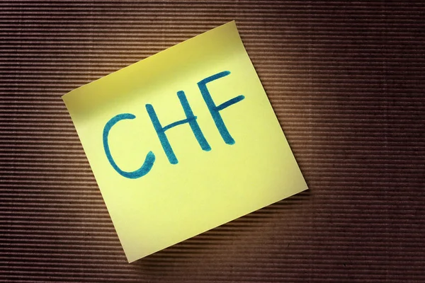 CHF (svájci frank) rövidítése, a sárga ragadós jegyzék — Stock Fotó