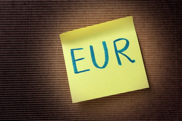 Text EUR na žlutý lístek s poznámkou — Stock fotografie