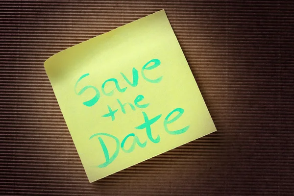 Save the date text on yellow sticky note — Stock Photo, Image