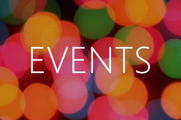 Events text on colorful bokeh background — Stock Photo, Image