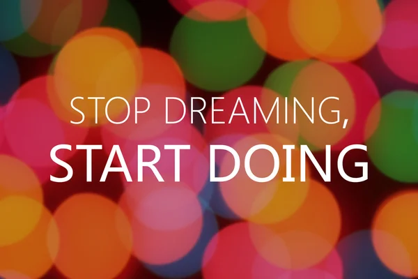 Stop dreaming, start doing text on colorful bokeh background — Stock Photo, Image