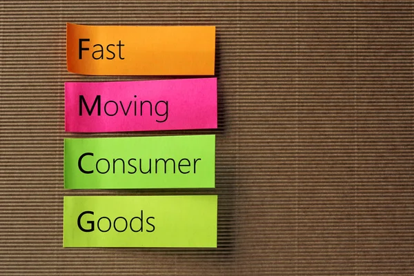 FMCG (Fast Moving Consumer Goods) afkorting op kleurrijke kleverige niet — Stockfoto
