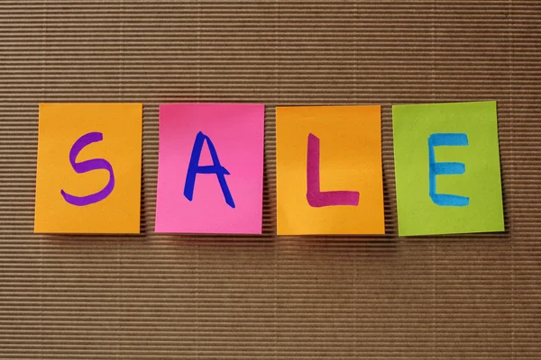 Sale text on colorful sticky notes — Stock Photo, Image