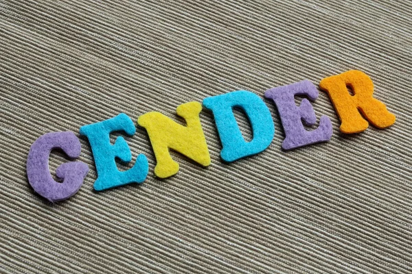 Гендерное слово из цветных войлочных букв — стоковое фото
