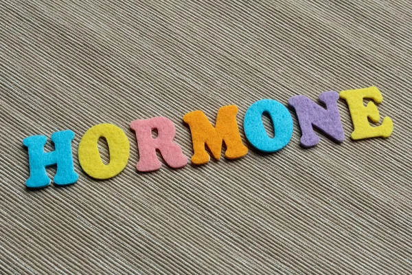 Palabra hormonal hecha con letras de fieltro coloridas —  Fotos de Stock