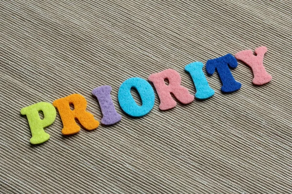 Priority word made with colorful felt letters — Stock Photo, Image