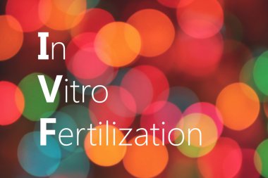 IVF (ın Vitro fertilizasyon) kısaltma renkli bokeh arka plan üzerinde