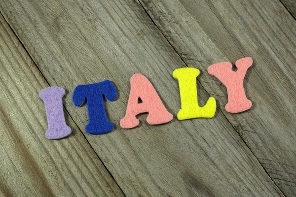 Italy word on wooden background — Stock Photo, Image