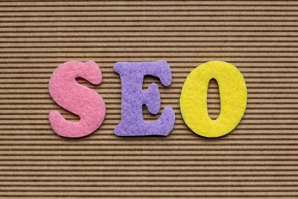 Seo （搜索引擎优化） 首字母缩略词在纸板的背景 — 图库照片