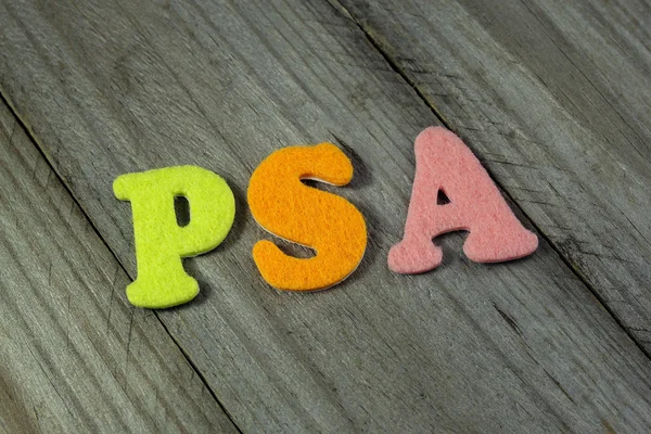 Акроним PSA (Prostate-specific antigen) на деревянном фоне — стоковое фото