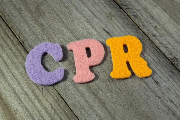 CPR (Cardiopulmonary Resuscitation) acronym on wooden background — Stock Photo, Image
