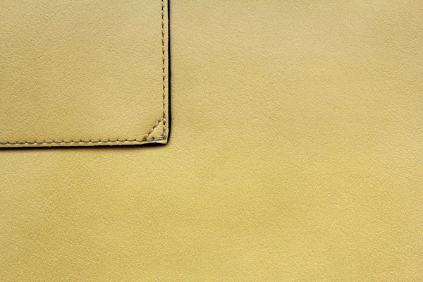 Yellow leather background with seam — Stock Photo, Image