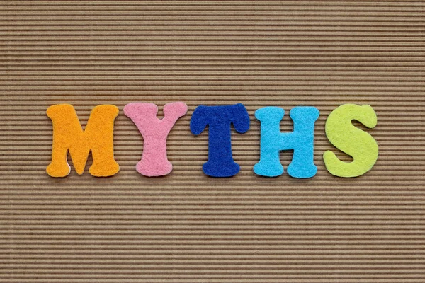 Myths word on cardboard background — Stock Photo, Image