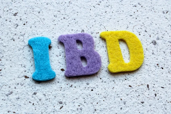 IBD (malattia infiammatoria intestinale) acronimo su tessitura di carta fatta a mano — Foto Stock