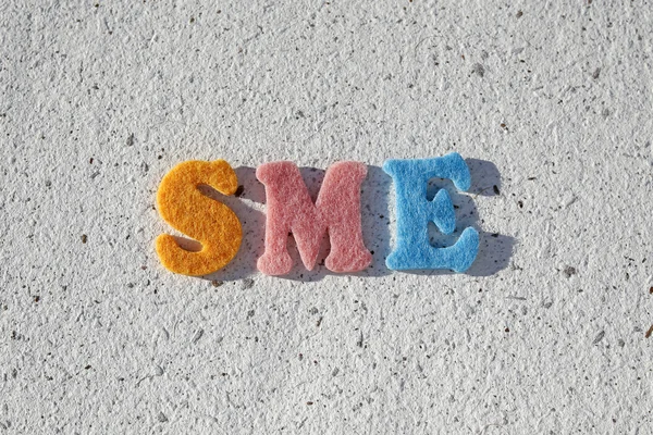 MŚP (małych średnich przedsiębiorstw) skrót na tekstury papieru czerpanego — Zdjęcie stockowe