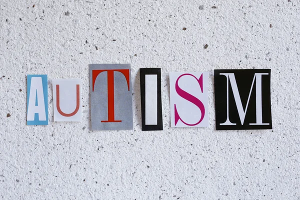 Palabra autismo en textura de papel hecha a mano — Foto de Stock