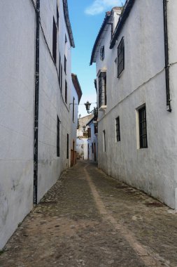 typical street in historic district of Ronda- very popular tourists town in Andalusia, Spain