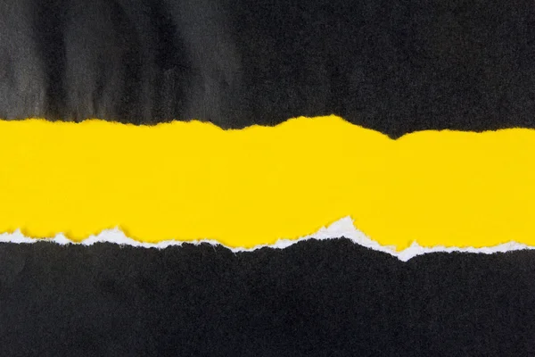 Black ripped paper, yellow space for copy — Stock Photo, Image