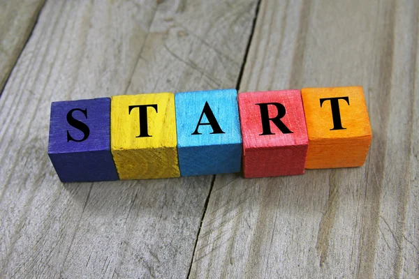 Concept of start word on wooden colorful cubes — Stock Photo, Image