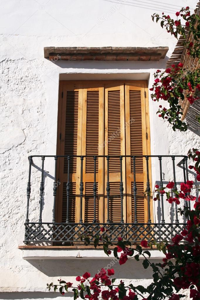 Balcony with wooden shutters