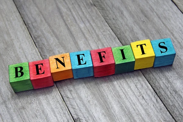 Concept of benefits word on wooden colorful cubes — Stock Photo, Image