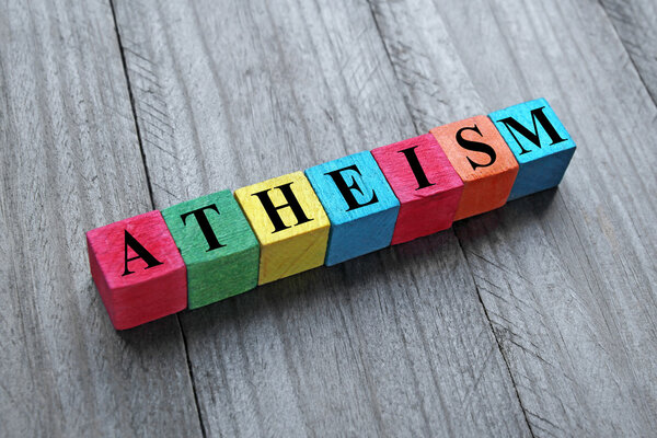 Concept of atheism word on colorful wooden cubes