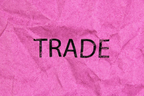 Concept of trade, word on pink paper — Stock Photo, Image