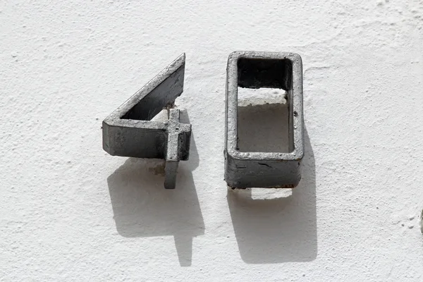 Number forty on white wall — Stock Photo, Image