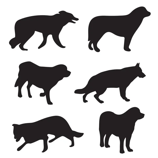 Svarta silhuetter av hundar — Stock vektor