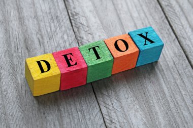 word detox on colorful wooden cubes clipart
