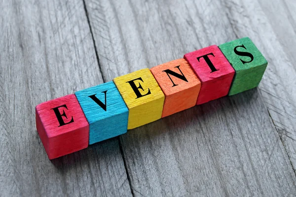 Word events on colorful wooden cubes — Stock Photo, Image