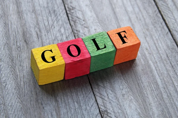 Word golf on colorful wooden cubes — Stock fotografie