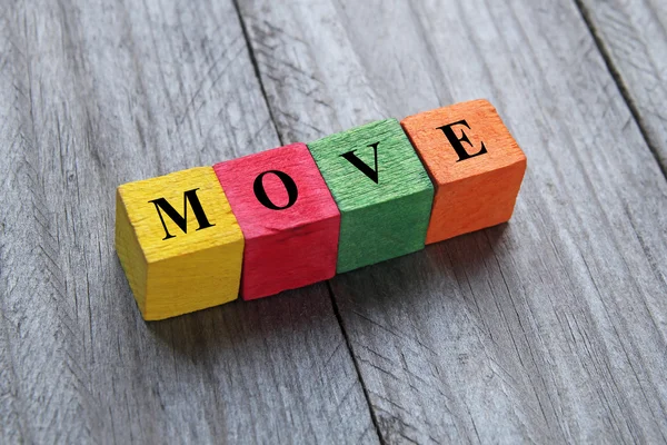 Word move on colorful wooden cubes — Stock Photo, Image